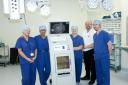 The breast services team at Whiston Hospital with the new specimen imaging system, Whiston Hospital