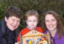 Karen Gay with Charlie Hext, four, and Kate Hext who looked after the village's nativity scene for the night
