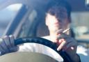 Smokers could face fines for smoking behind the wheel, even though it is not illegal