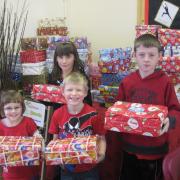 From left, Jonathan Bignall, Daisy Wilks, Samuel Illidge and Jessica Bazley with some of their Christmas gifts