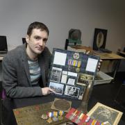Neil Thornton with military memorabilia brought to Halton Lea Library to celebrate the centenary of the Great War