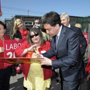 Ed Miliband signs autographs IPG18415