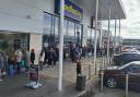 Shoppers queue to visit The Range in Widnes