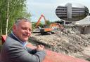 Mike Amesbury looks on as diggers move in to flatten East Lane House (inset)