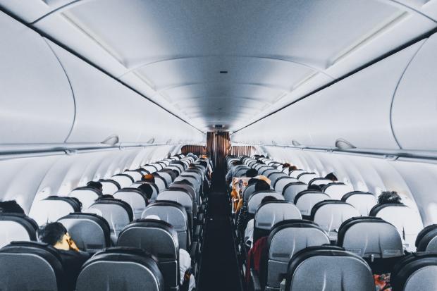 Runcorn and Widnes World: Rows of empty seats on a plane. Credit: Canva