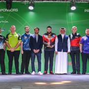 The PDC players, including Luke Littler second from right, with dignitaries  at last night's draw in Bahrain
