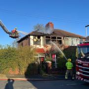 Firefighters hose down house on St Anne's Road in Widnes wrecked in a fierce blaze