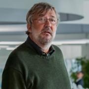 Stephen Fry as Ian Gibbons